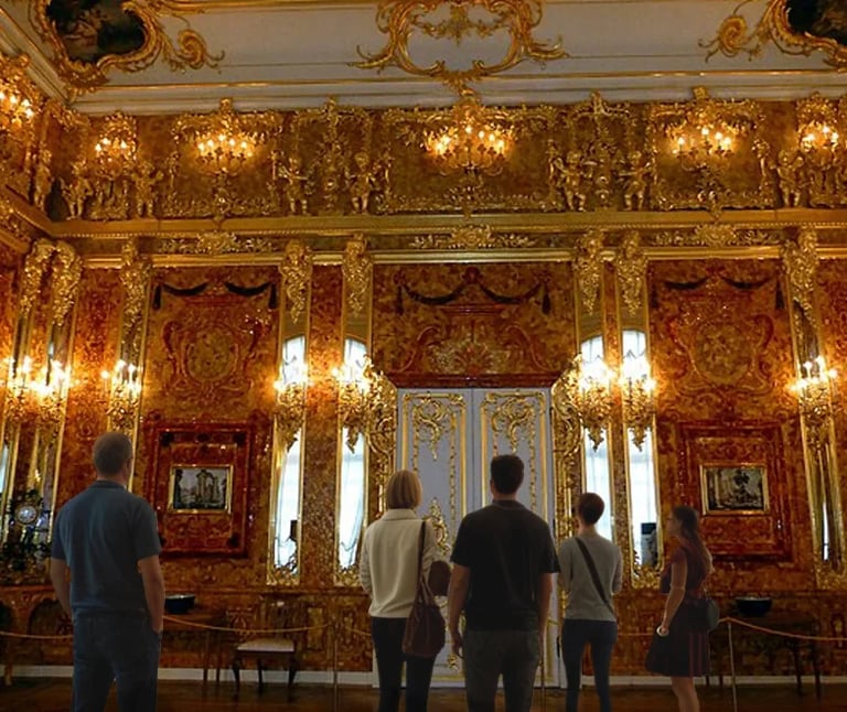 Ornate palace room with gold-decorated walls, red panels, and crystal chandeliers, tourists viewing the elaborate baroque interior
